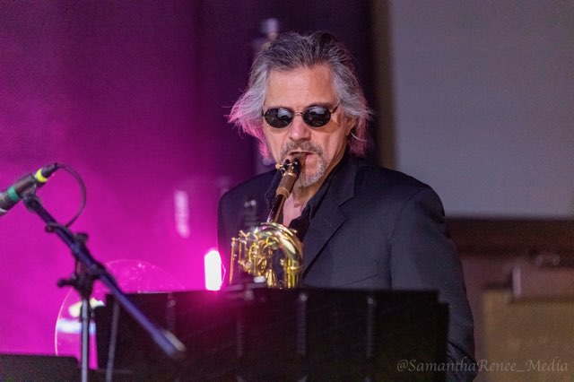 john lennon tribute band member on saxophone